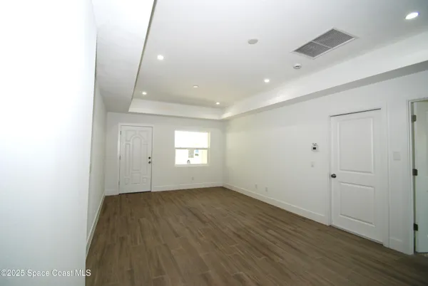 a large kitchen with kitchen island a sink stainless steel appliances and cabinets