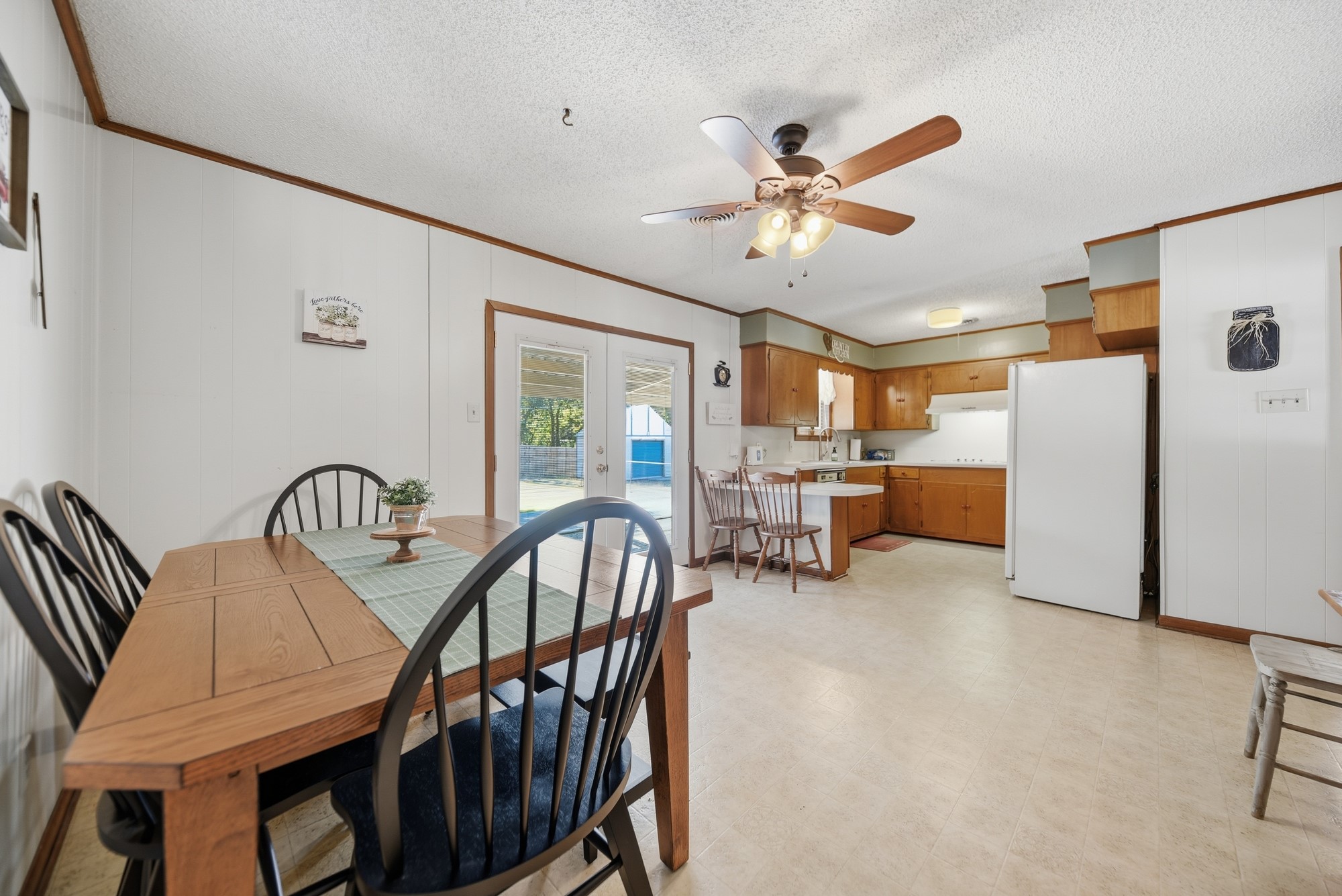 1705 Eldon Street Brenham, TX 77833 - Photo 11 of 30 a view of a dining room with furniture and a chandelier