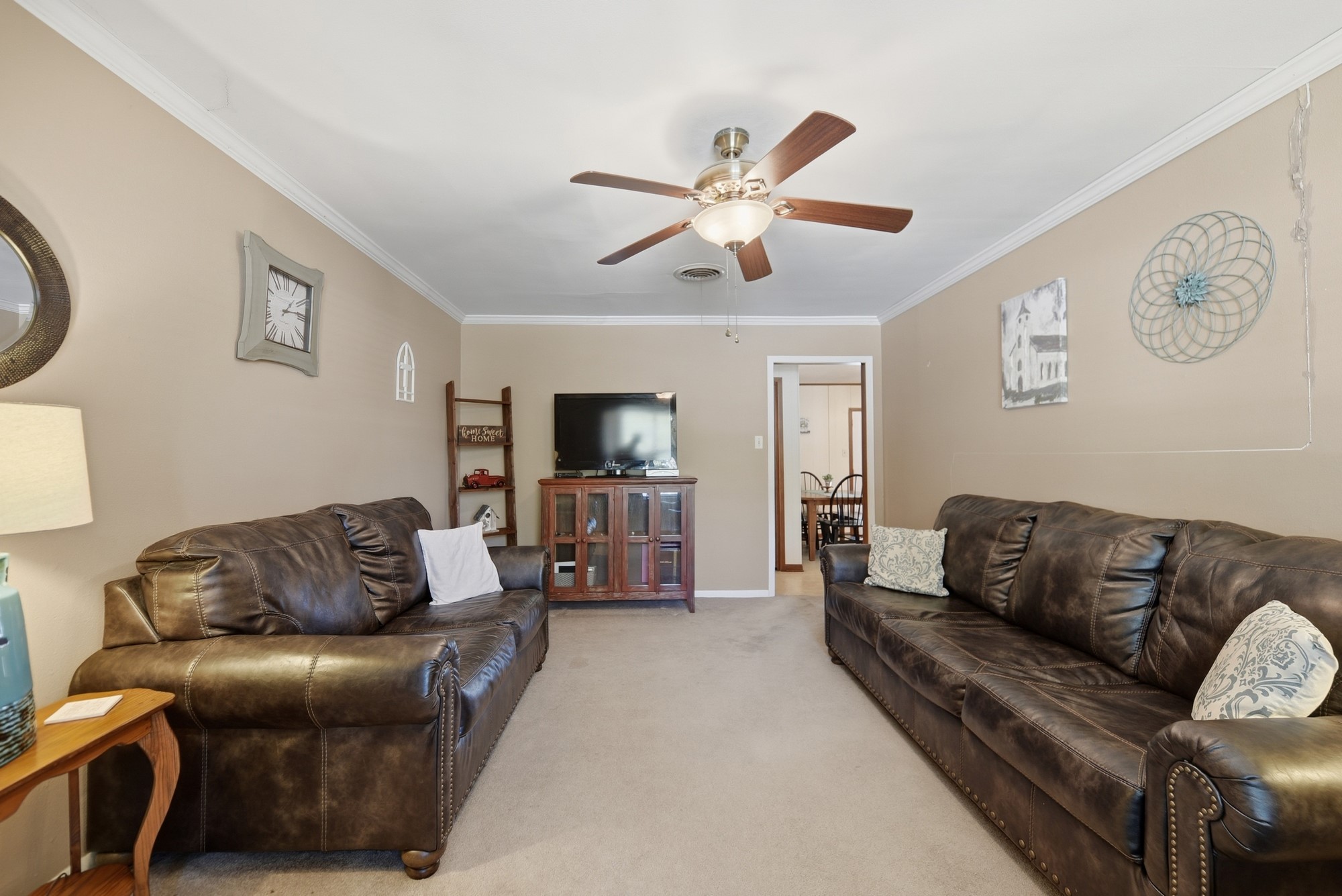 1705 Eldon Street Brenham, TX 77833 - Photo 2 of 30 a living room with furniture and a flat screen tv