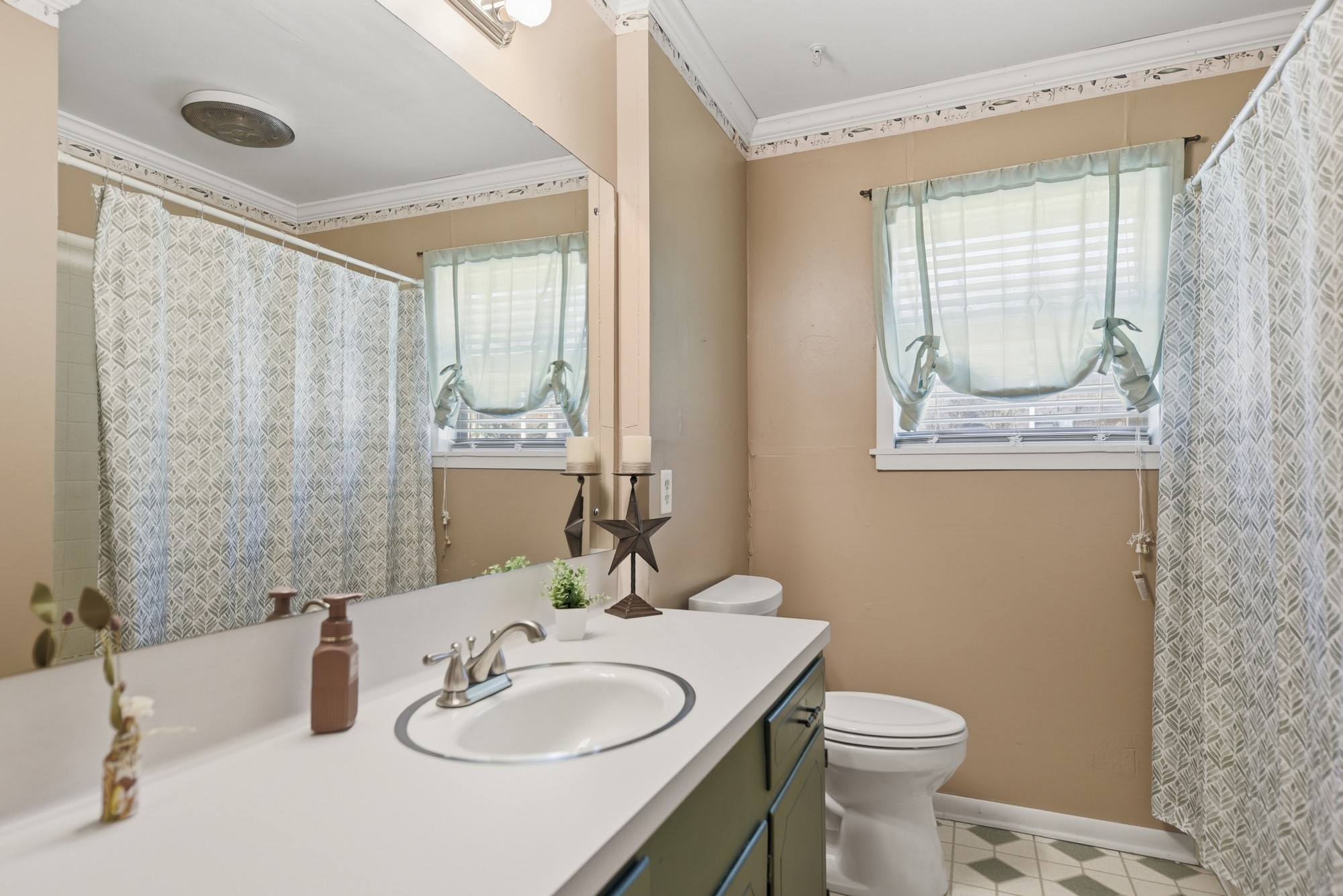 1705 Eldon Street Brenham, TX 77833 - Photo 22 of 30 a bathroom with a sink a toilet and shower