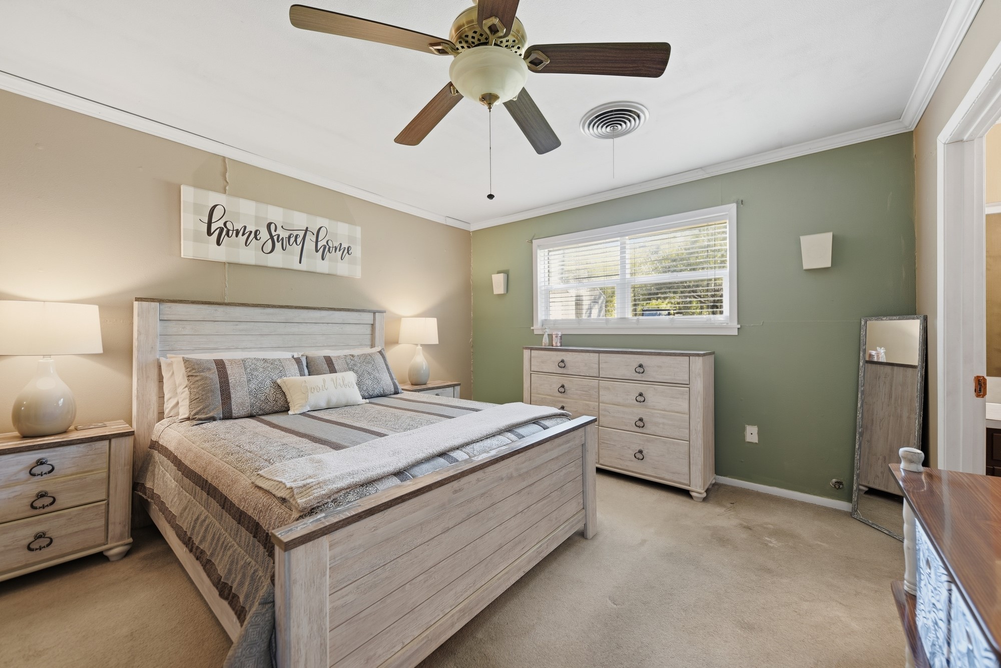 1705 Eldon Street Brenham, TX 77833 - Photo 3 of 30 a bedroom with a bed and a chandelier