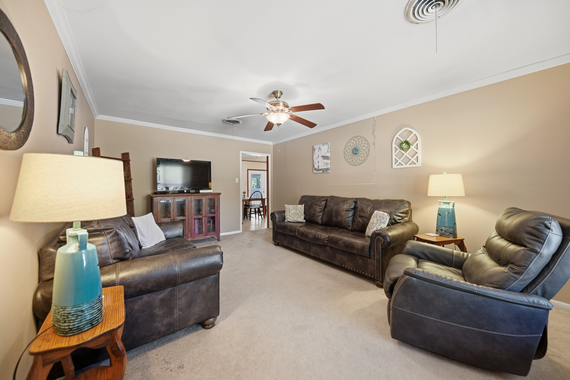 1705 Eldon Street Brenham, TX 77833 - Photo 10 of 30 a living room with furniture and a flat screen tv