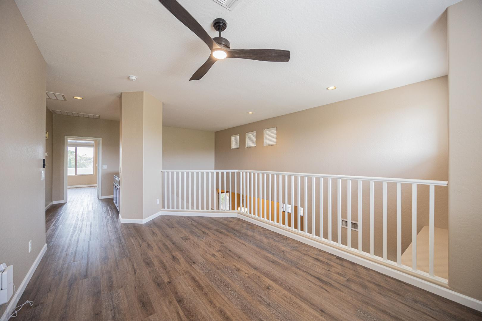 6539 West Jomax Road Phoenix, AZ 85083 - Photo 14 of 39 wooden floor in a hall with a window