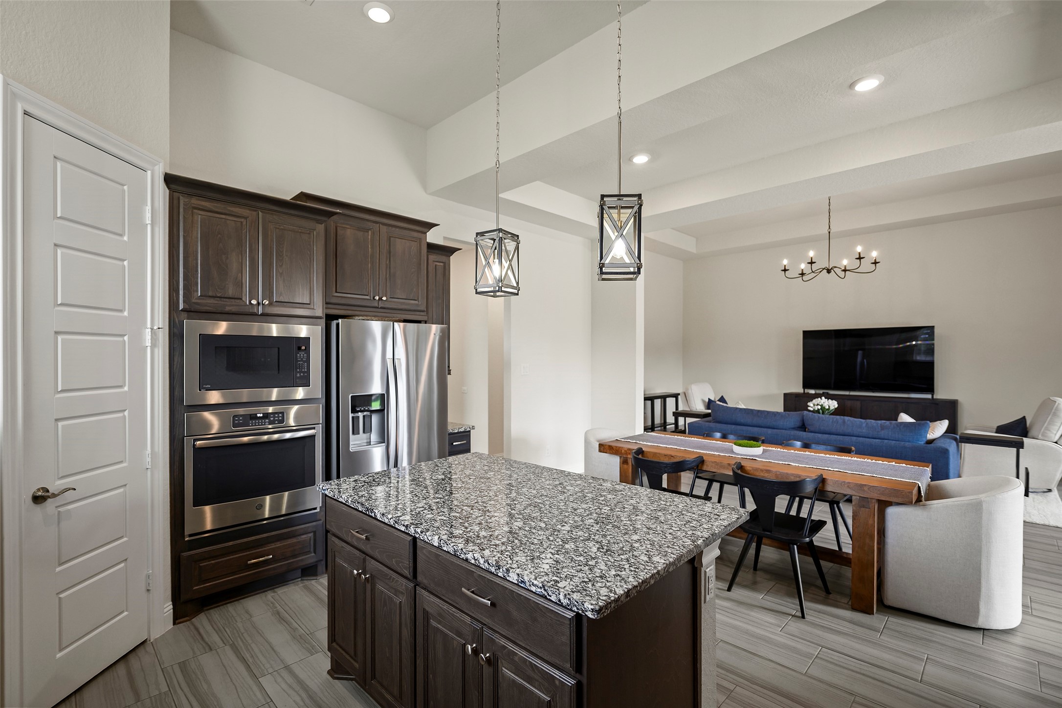 20330 Rosegold Way Spring, TX 77379 - Photo 4 of 48 Kitchen opens seamlessly to the dining and living areas, creating the perfect space for entertaining and everyday living.