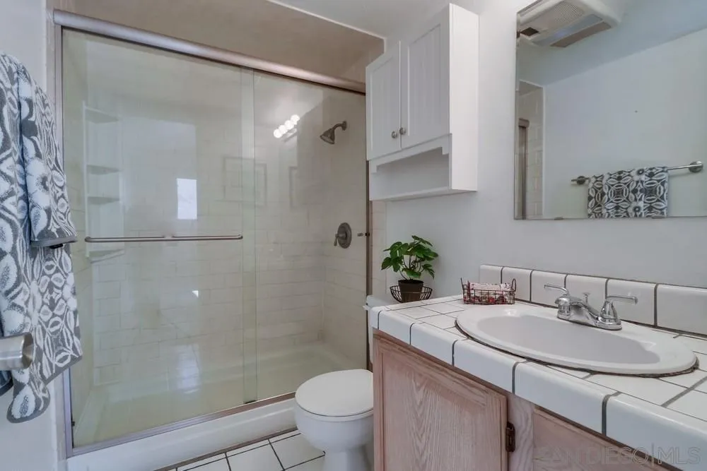4768 35th Street, Unit 4 San Diego, CA 92116 - Photo 16 of 27 a bathroom with a sink toilet and shower