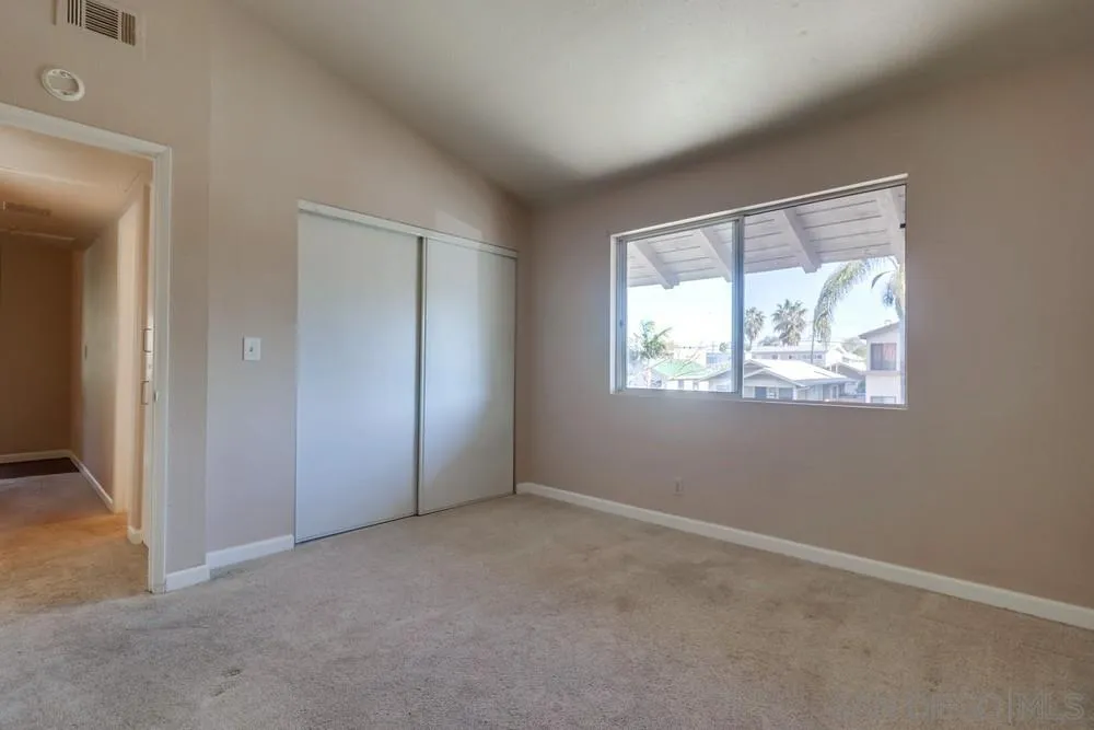 4768 35th Street, Unit 4 San Diego, CA 92116 - Photo 19 of 27 an empty room with windows
