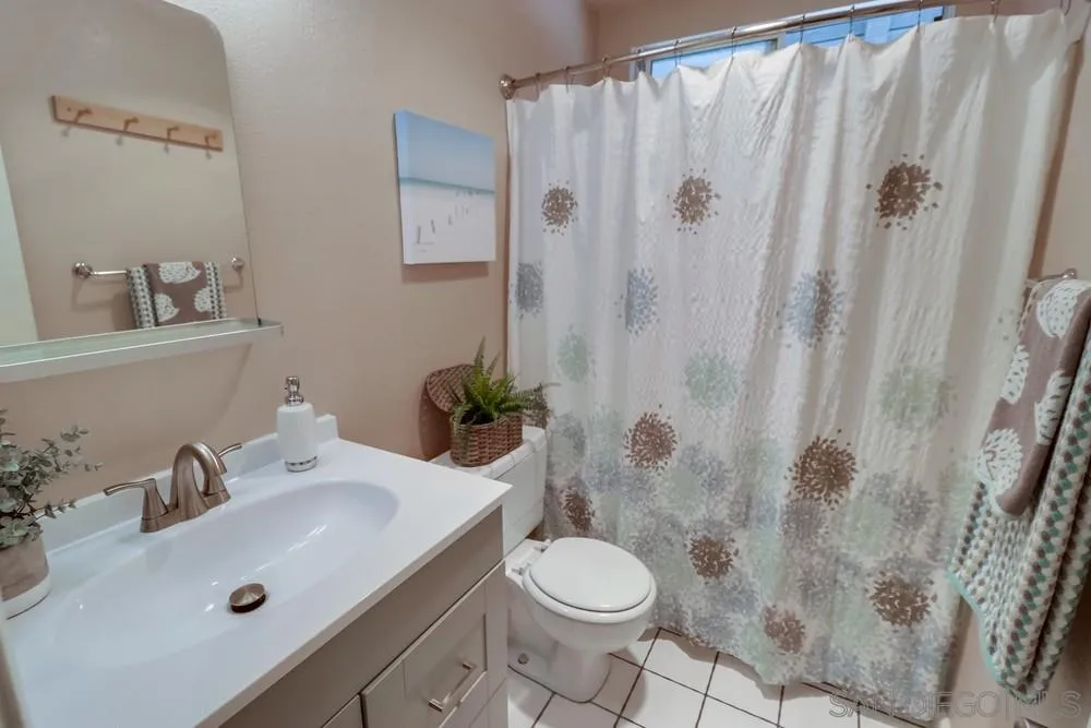 4768 35th Street, Unit 4 San Diego, CA 92116 - Photo 20 of 27 a bathroom with a sink toilet and shower