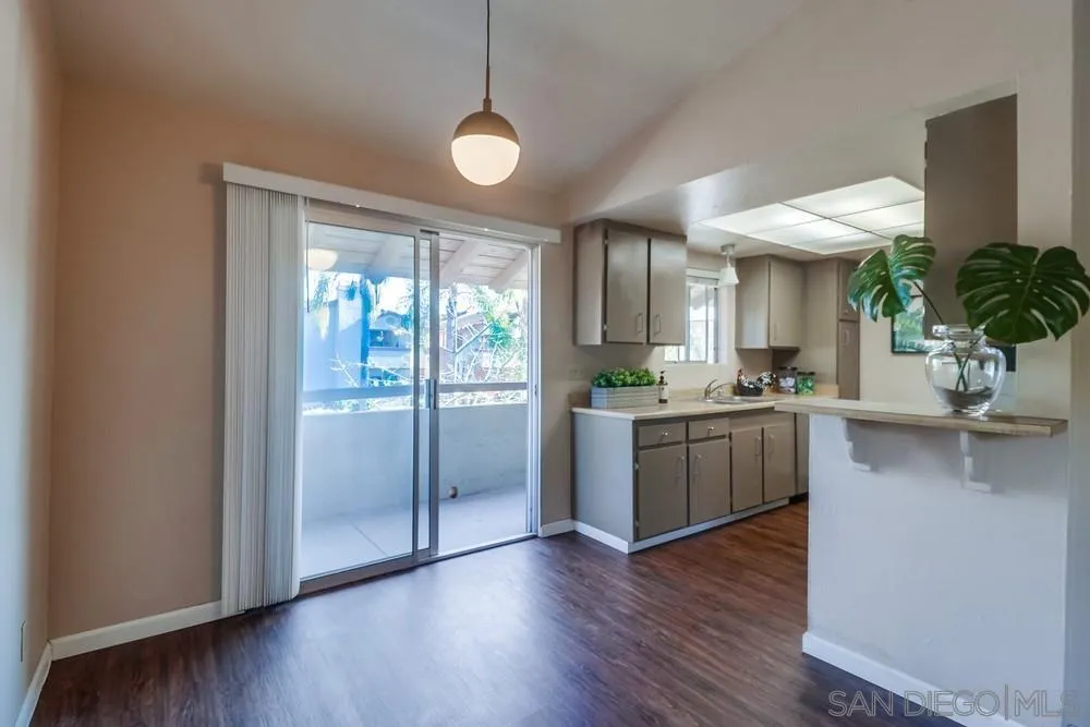 4768 35th Street, Unit 4 San Diego, CA 92116 - Photo 5 of 27 a kitchen with a refrigerator and wooden floor