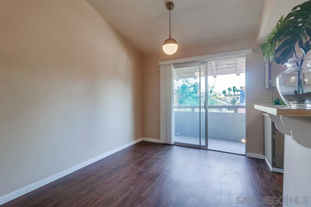 4768 35th Street, Unit 4 San Diego, CA 92116 - Photo 6 of 27 a view of empty room with wooden floor and fan