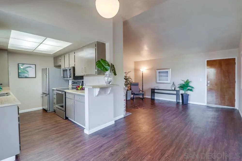 4768 35th Street, Unit 4 San Diego, CA 92116 - Photo 7 of 27 a view of kitchen with furniture and wooden floor