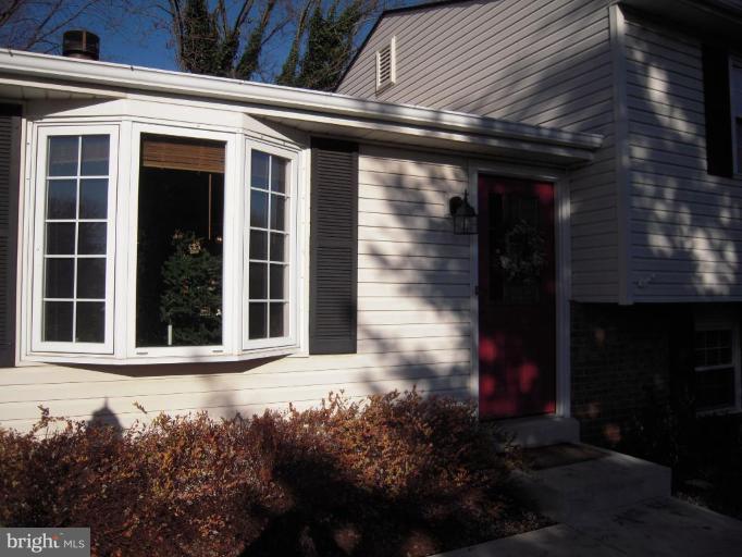 17317 Soper Street Poolesville, MD 20837 - Photo 2 of 29 a front view of a house with a yard