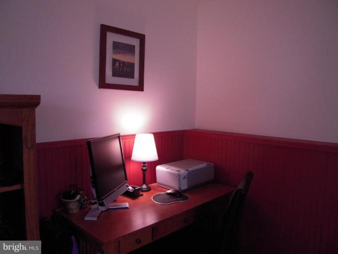 17317 Soper Street Poolesville, MD 20837 - Photo 13 of 29 a bedroom with a bed chair and a lamp on desk