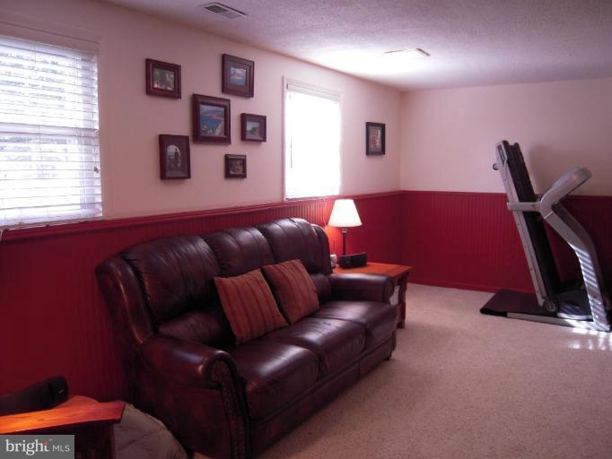 17317 Soper Street Poolesville, MD 20837 - Photo 15 of 29 a living room with furniture and a window