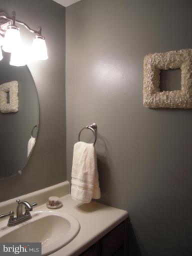 17317 Soper Street Poolesville, MD 20837 - Photo 21 of 29 a bathroom with a sink and a mirror