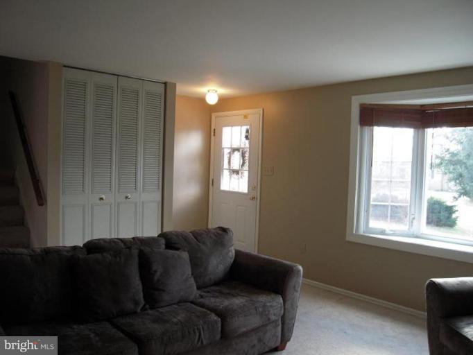 17317 Soper Street Poolesville, MD 20837 - Photo 26 of 29 a living room with furniture and a window