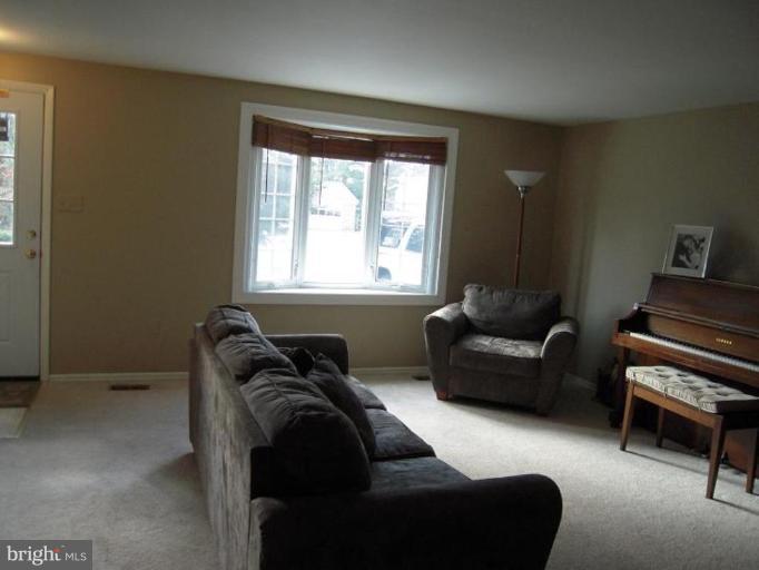 17317 Soper Street Poolesville, MD 20837 - Photo 27 of 29 a living room with furniture and a window