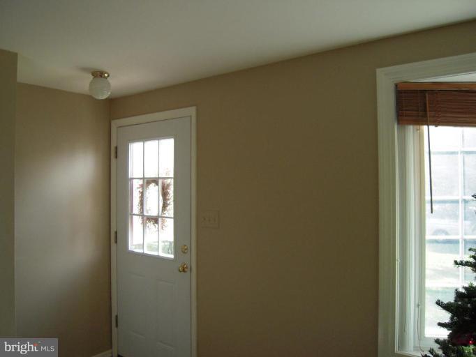 17317 Soper Street Poolesville, MD 20837 - Photo 4 of 29 a view of an empty room and a window