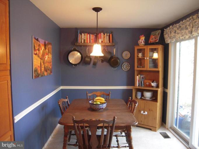 17317 Soper Street Poolesville, MD 20837 - Photo 10 of 29 a view of a dining room with furniture and window