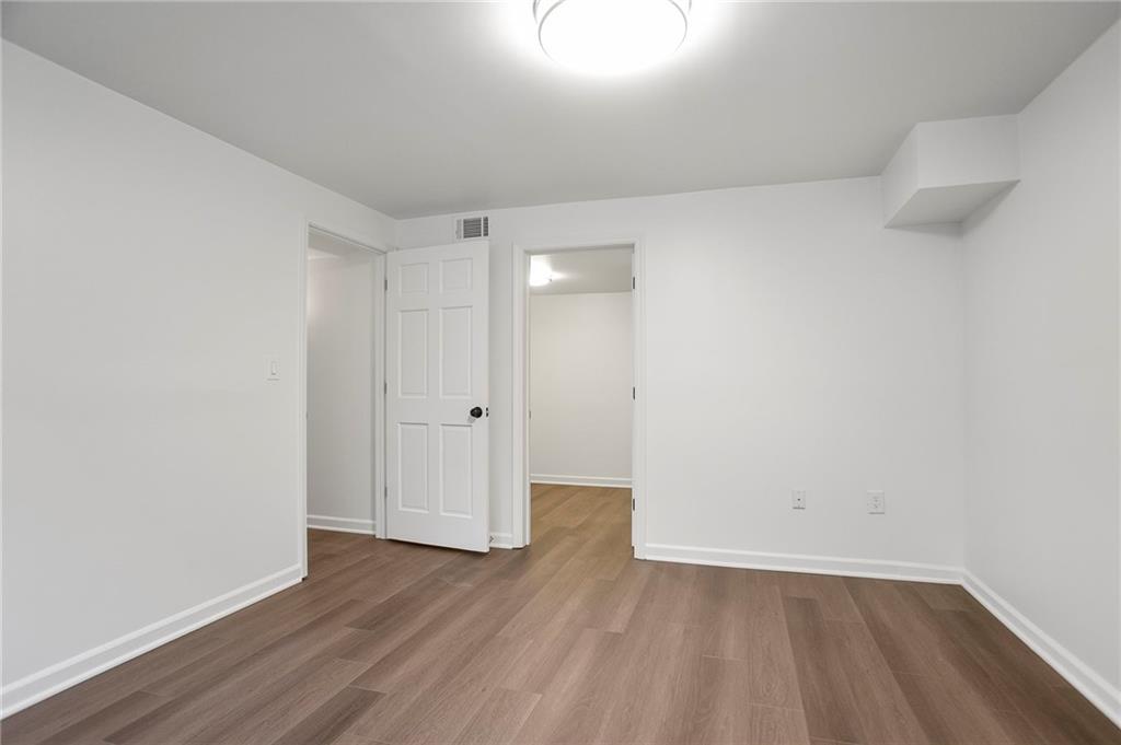 4555 Runnemede Road Northwest Atlanta, GA 30327 - Photo 29 of 51 a view of an empty room and wooden floor
