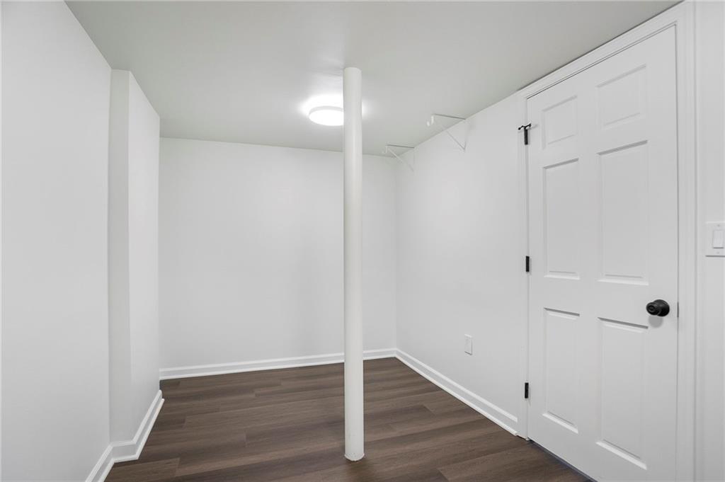 4555 Runnemede Road Northwest Atlanta, GA 30327 - Photo 30 of 51 a view of an empty room with wooden floor