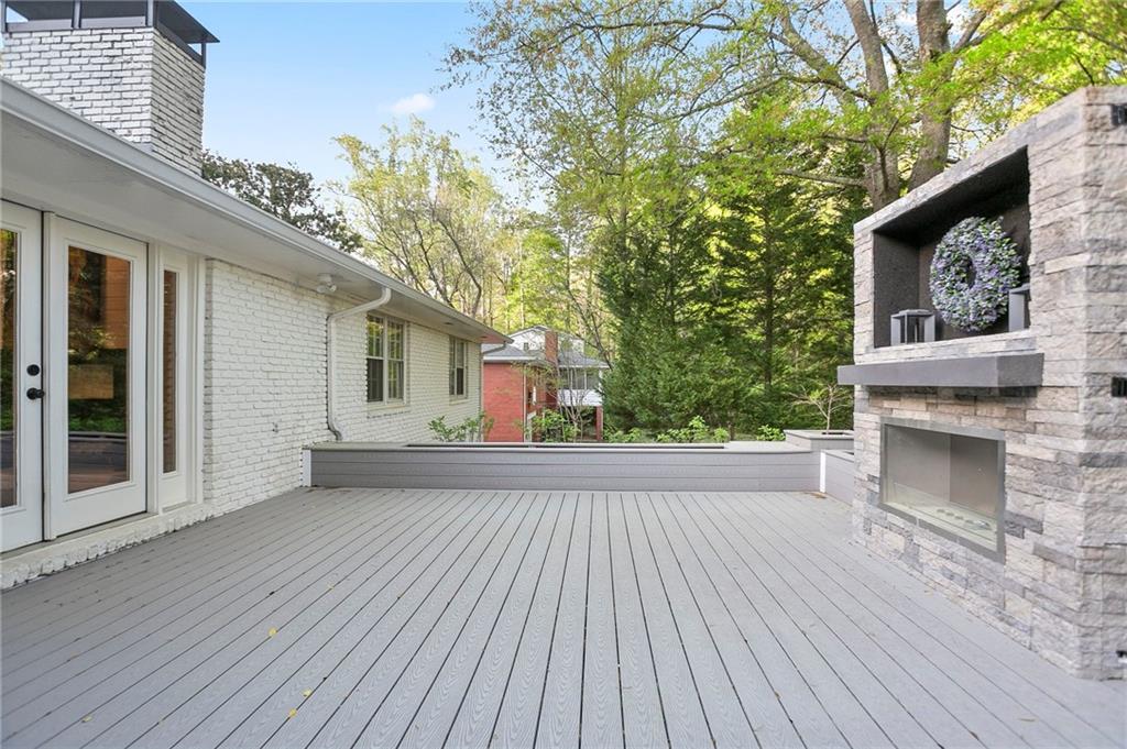 4555 Runnemede Road Northwest Atlanta, GA 30327 - Photo 34 of 51 a view of a house with a deck