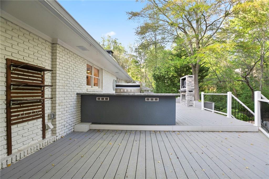 4555 Runnemede Road Northwest Atlanta, GA 30327 - Photo 36 of 51 a view of a balcony with wooden floor and fence