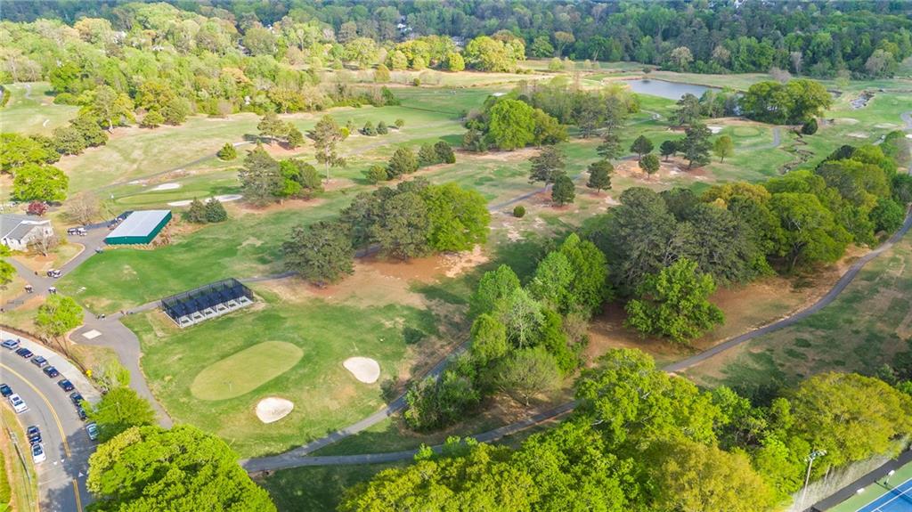 4555 Runnemede Road Northwest Atlanta, GA 30327 - Photo 43 of 51 a view of a lake with a yard