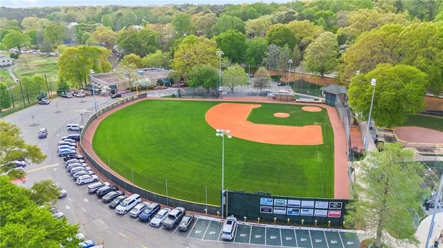 a view of a house with a yard and sitting area