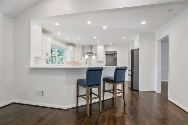 a kitchen with a table and chairs in it