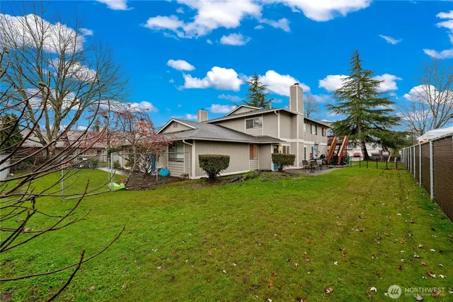a view of a house with a yard