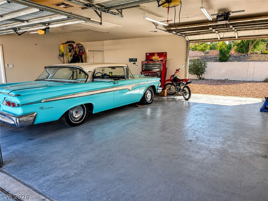 524 Swallow Cove Boulder City, NV 89005 - Photo 36 of 58 Secure storage for vehicles, this garage offers practical space with a concrete floor.