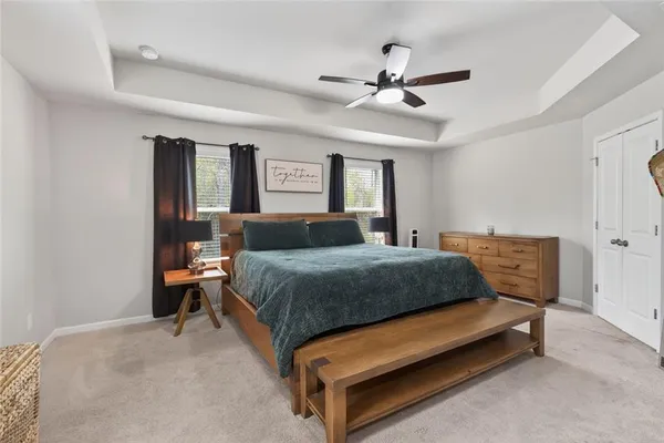 a bedroom with a bed and window