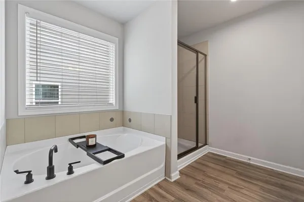 a bathroom with a bathtub and a sink