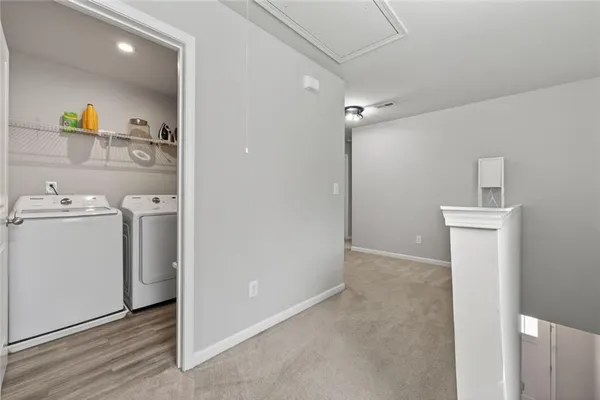a view of a storage & utility room with a washer and dryer