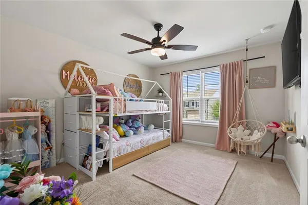 a bedroom with furniture and a window