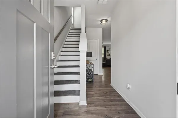 a view of entryway with wooden floor