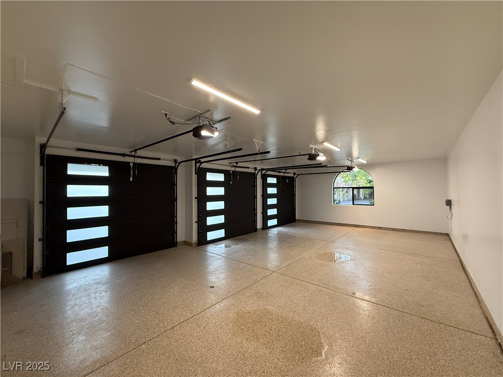 2316 Prometheus Court Henderson, NV 89074 - Photo 63 of 92 Garage with baseboards and a garage door opener