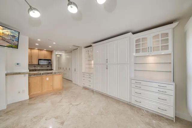 a view of walk in closet with white walls