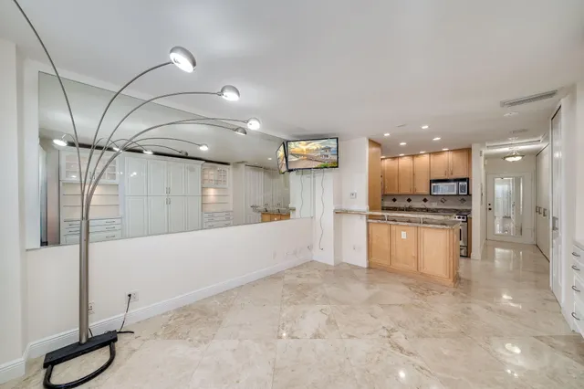 a kitchen with stainless steel appliances granite countertop a stove and a refrigerator
