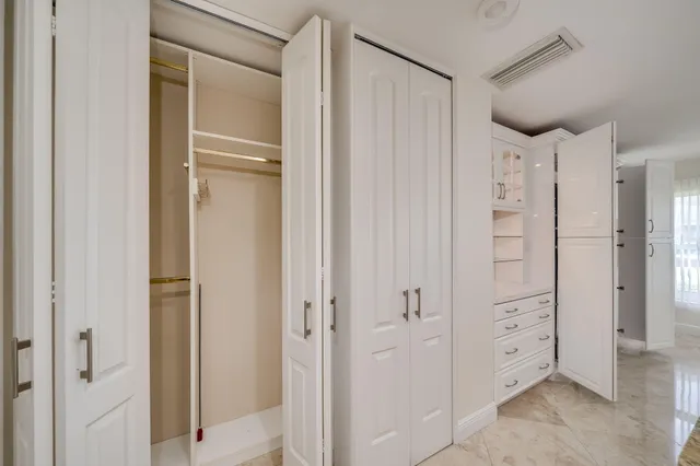 a view of a building stairs and a refrigerator