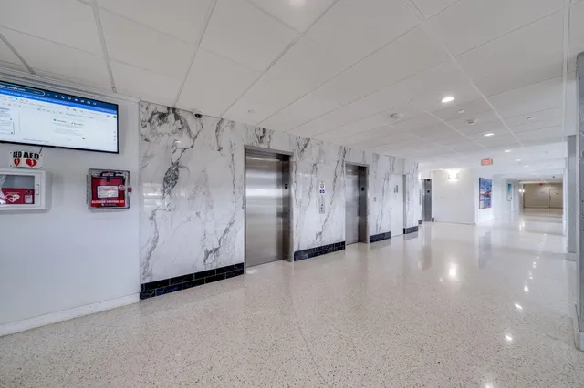 a building with trees in front of it