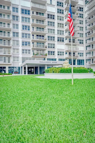 an aerial view of a house with a yard lake view and mountain view