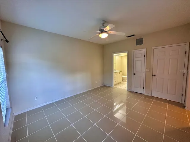 an empty room with a bathroom