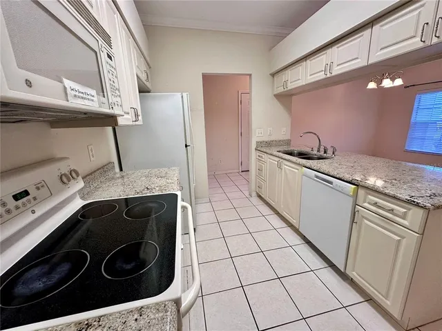 a kitchen with a stove and a sink