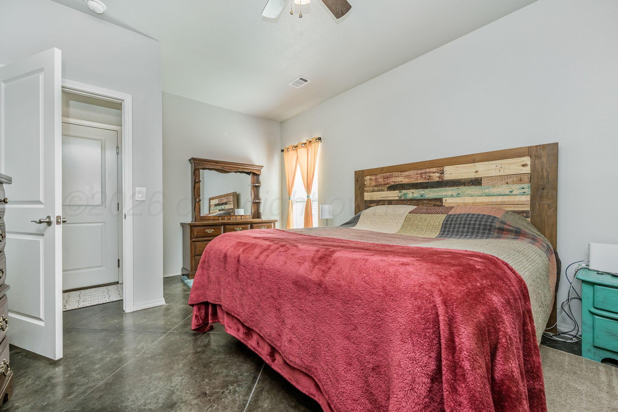 4700 Longbird Street Amarillo, TX 79118 - Photo 11 of 23 a bedroom with a bed and a window