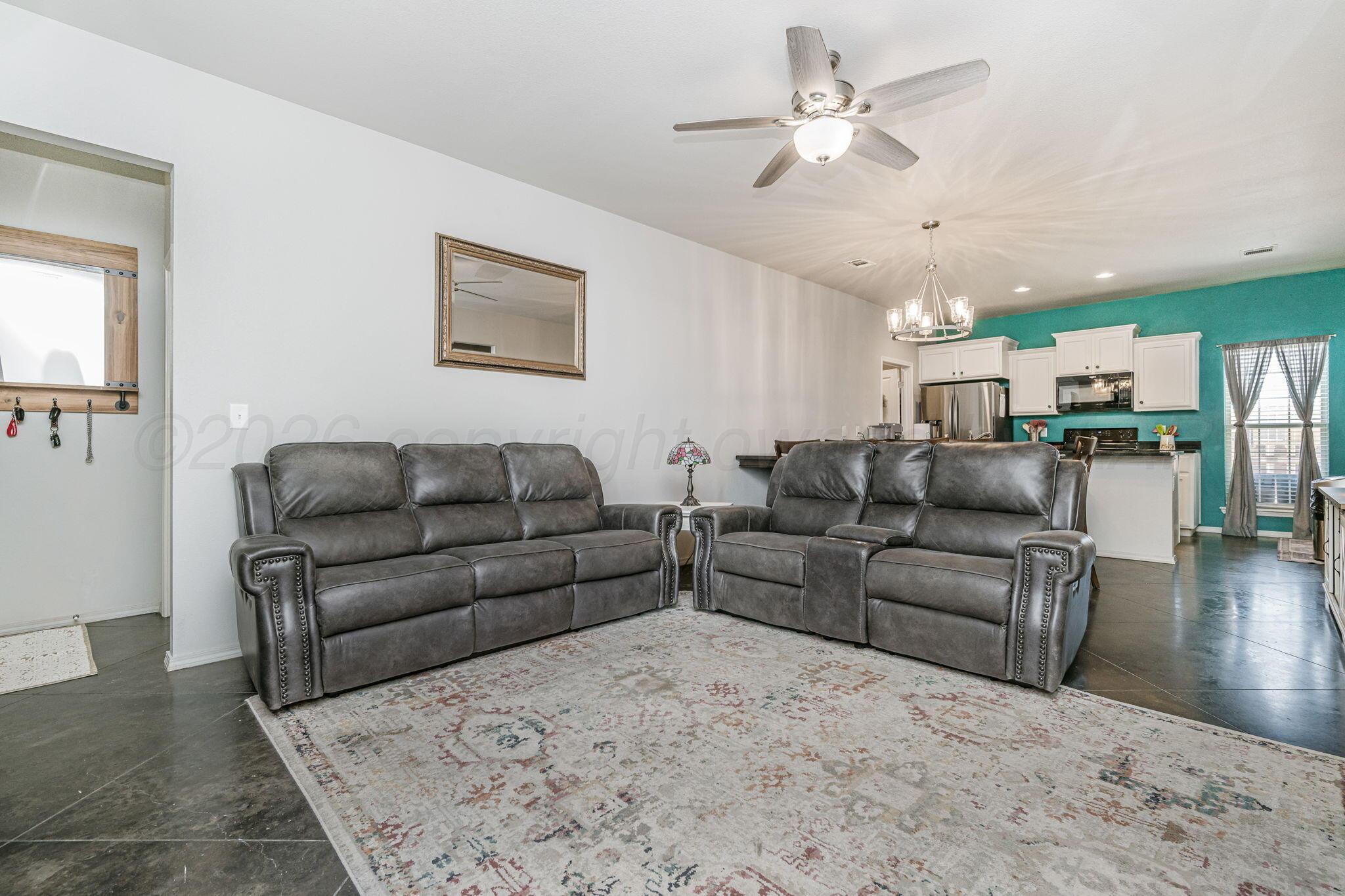 4700 Longbird Street Amarillo, TX 79118 - Photo 3 of 23 a living room with furniture and kitchen view