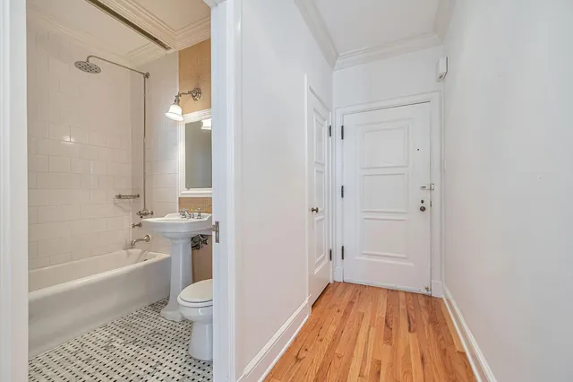 a bathroom with a sink a toilet and a bathtub