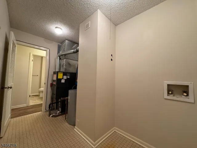 a view of room with hallway and a closet