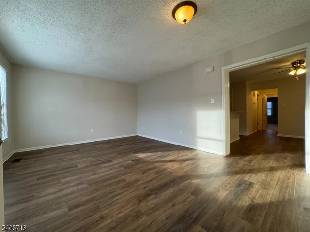 a view of a livingroom with wooden floor