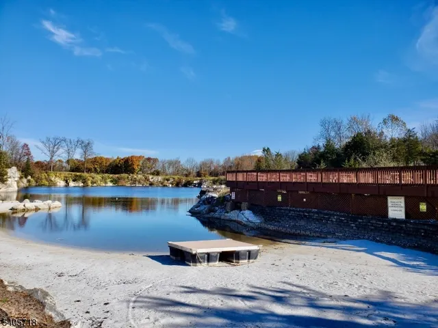 an aerial view of a house with a lake view
